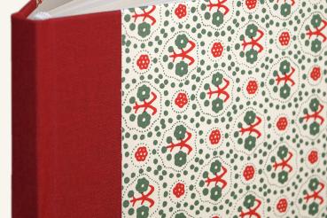 Hard cover notebook with green and red pattern, red linen spine